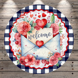 A round, decorative sign with a floral border and a welcoming message. The sign is surrounded by red roses and other flowers, and features a heart-shaped envelope with the word "welcome" written on it.