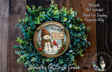 A wreath with a snowman and a sign that says "Merry Christmas" is displayed on a wooden background.