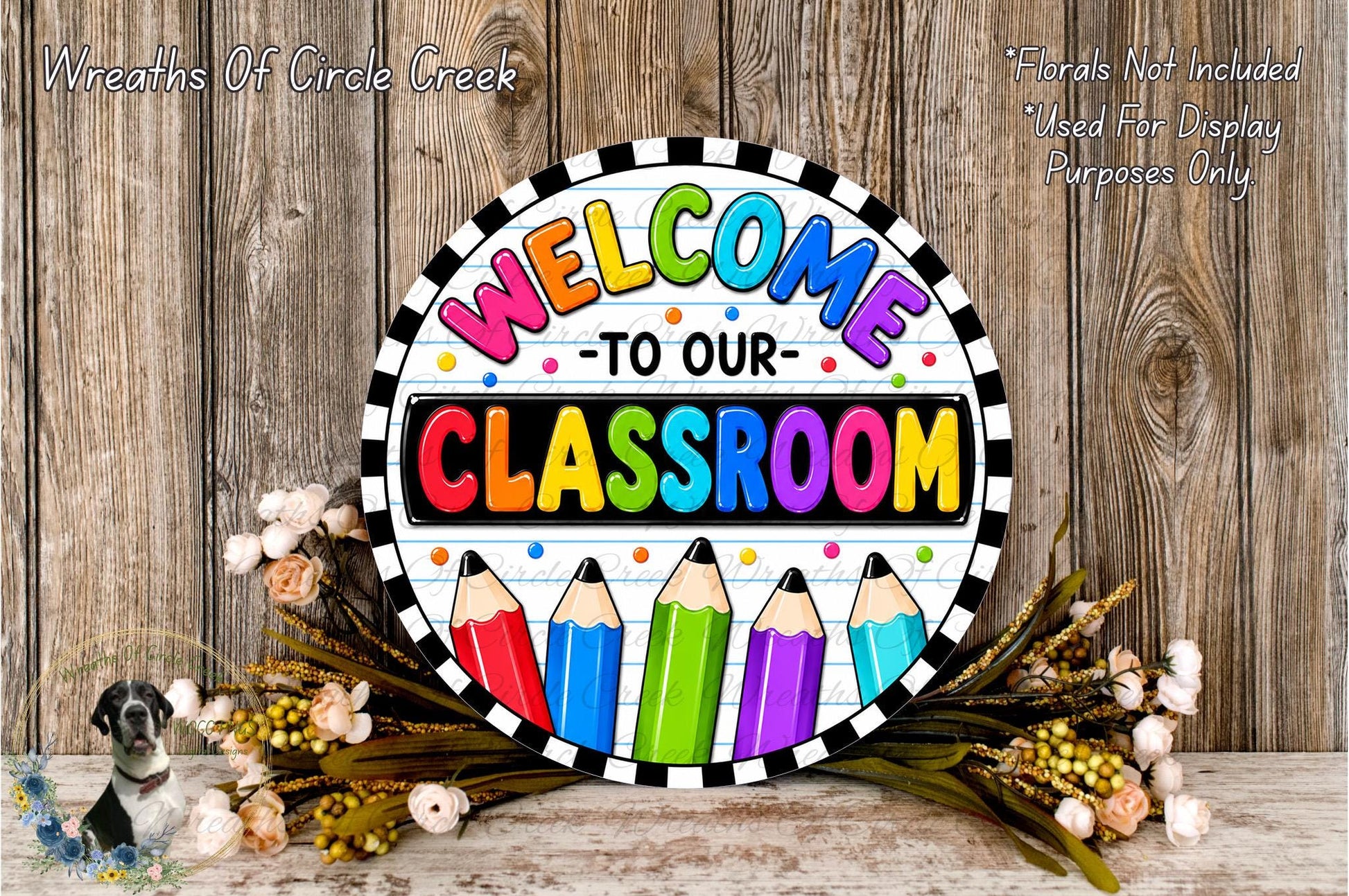 A colorful welcome sign for a classroom, featuring the text "Welcome to our classroom" surrounded by pencils and flowers.
