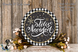 a festive wreath with the text &quot;Feliz Navidad&quot; (Happy New Year) written on it, surrounded by a floral arrangement and a wooden background.