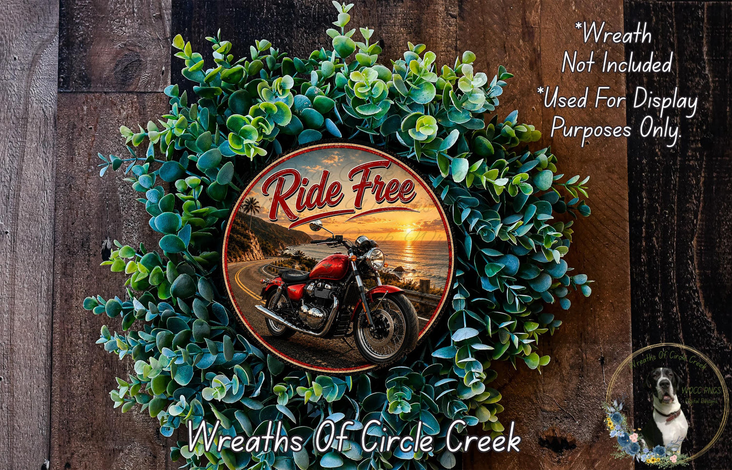 a wreath with a motorcycle and a sunset in the background, surrounded by greenery.