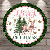 A circular Christmas-themed design with a pink and green color scheme, featuring a deer, pine trees, and stars. The text "Merry Christmas" is prominently displayed in the center of the design.