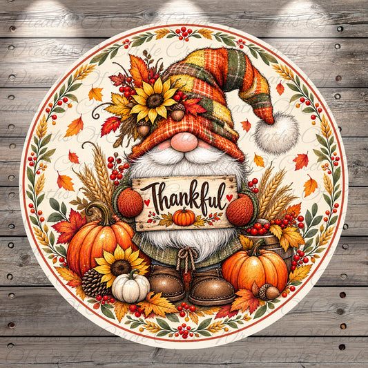 A decorative plate featuring a gnome holding a "Thankful" sign, surrounded by autumn elements such as sunflowers, pumpkins, and leaves.