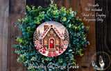 A wreath featuring a gingerbread house surrounded by greenery, with a caption stating that the wreath is not included in a display and is used for purposes only.