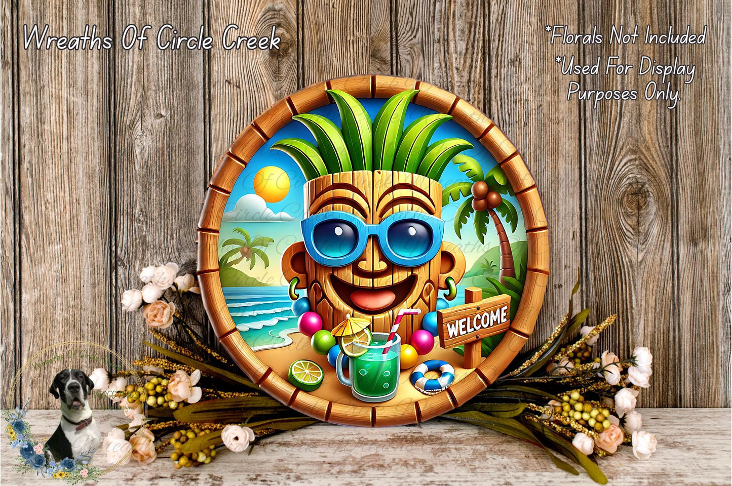 A round wooden plaque with a tropical theme, featuring a smiling tiki mask, sunglasses, a drink, and a "Welcome" sign. The plaque is surrounded by flowers and a bird, creating a festive and welcoming atmosphere.