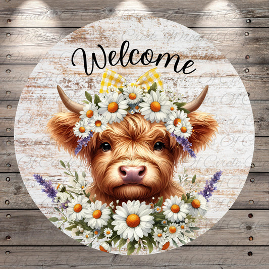 A cow wearing a flower crown and surrounded by a wreath of white and orange flowers, with the word "Welcome" written above it.