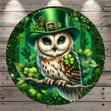 A digital illustration of an owl wearing a green top hat with a green shamrock on its beak, surrounded by green shamrocks and leaves.