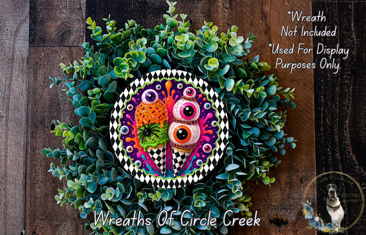 a colorful wreath made of various plants and a decorative plate with a whimsical design, including a pair of eyes and a pineapple. The wreath is displayed on a wooden surface, and there is a small dog in the background.