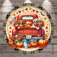 A red truck with a skeleton and ghost on the back, surrounded by pumpkins and autumn leaves, with the text "HELLO FALL WOOF" displayed on the truck.