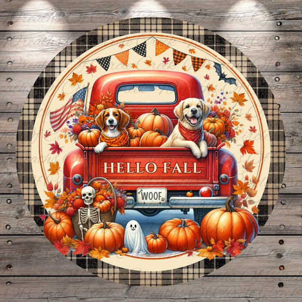 A red truck with a skeleton and ghost on the back, surrounded by pumpkins and autumn leaves, with the text "HELLO FALL WOOF" displayed on the truck.