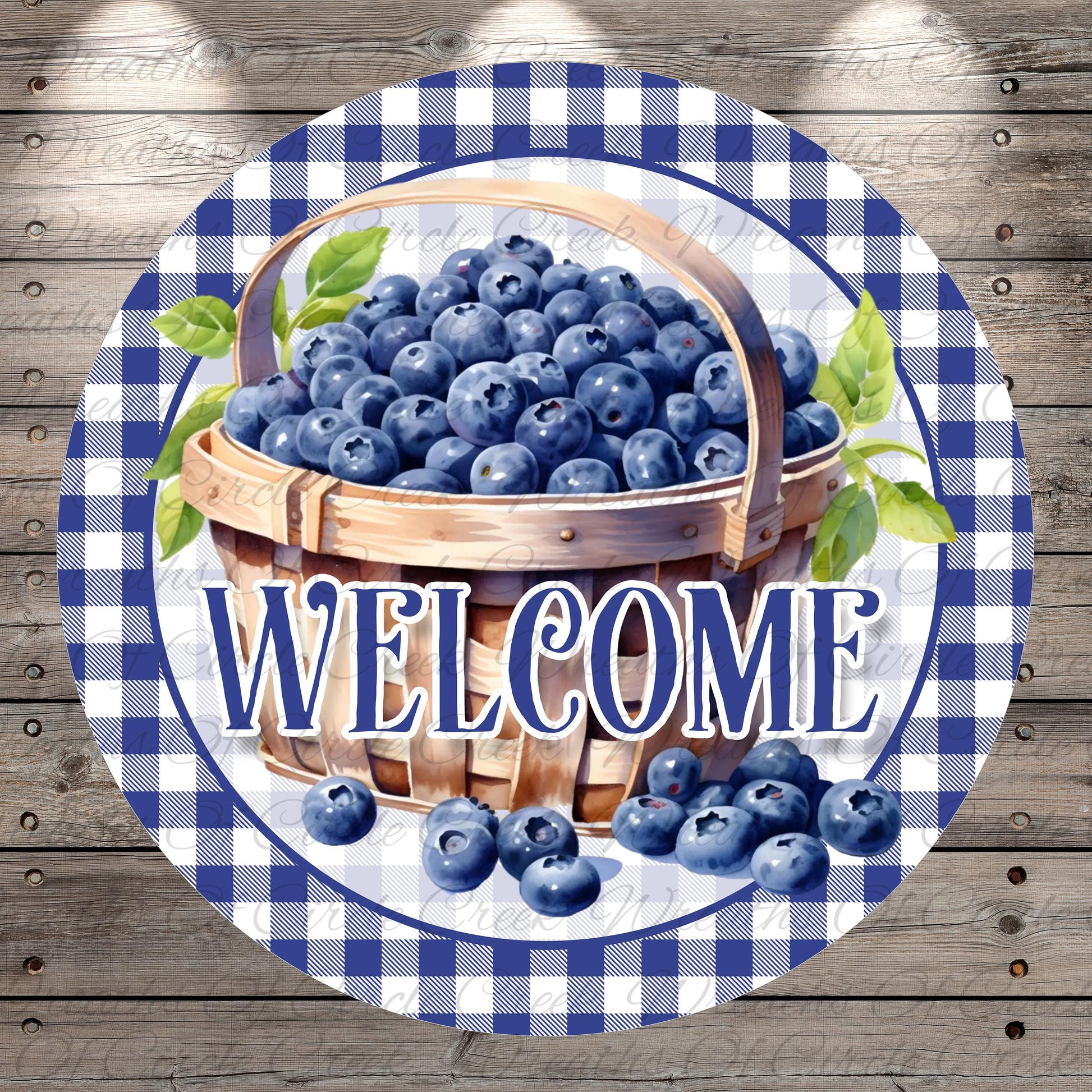 A round sign with a basket of blueberries and the word "WELCOME" written on it.