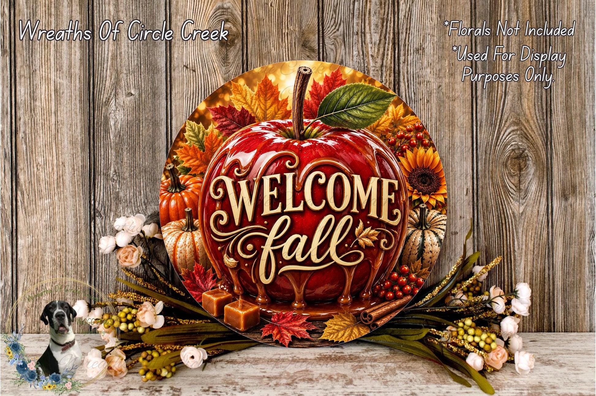a decorative sign with the text "Welcome fall" surrounded by autumn-themed elements such as leaves, pumpkins, and flowers. The sign is placed on a wooden surface, and there is a small bird figurine in the background.