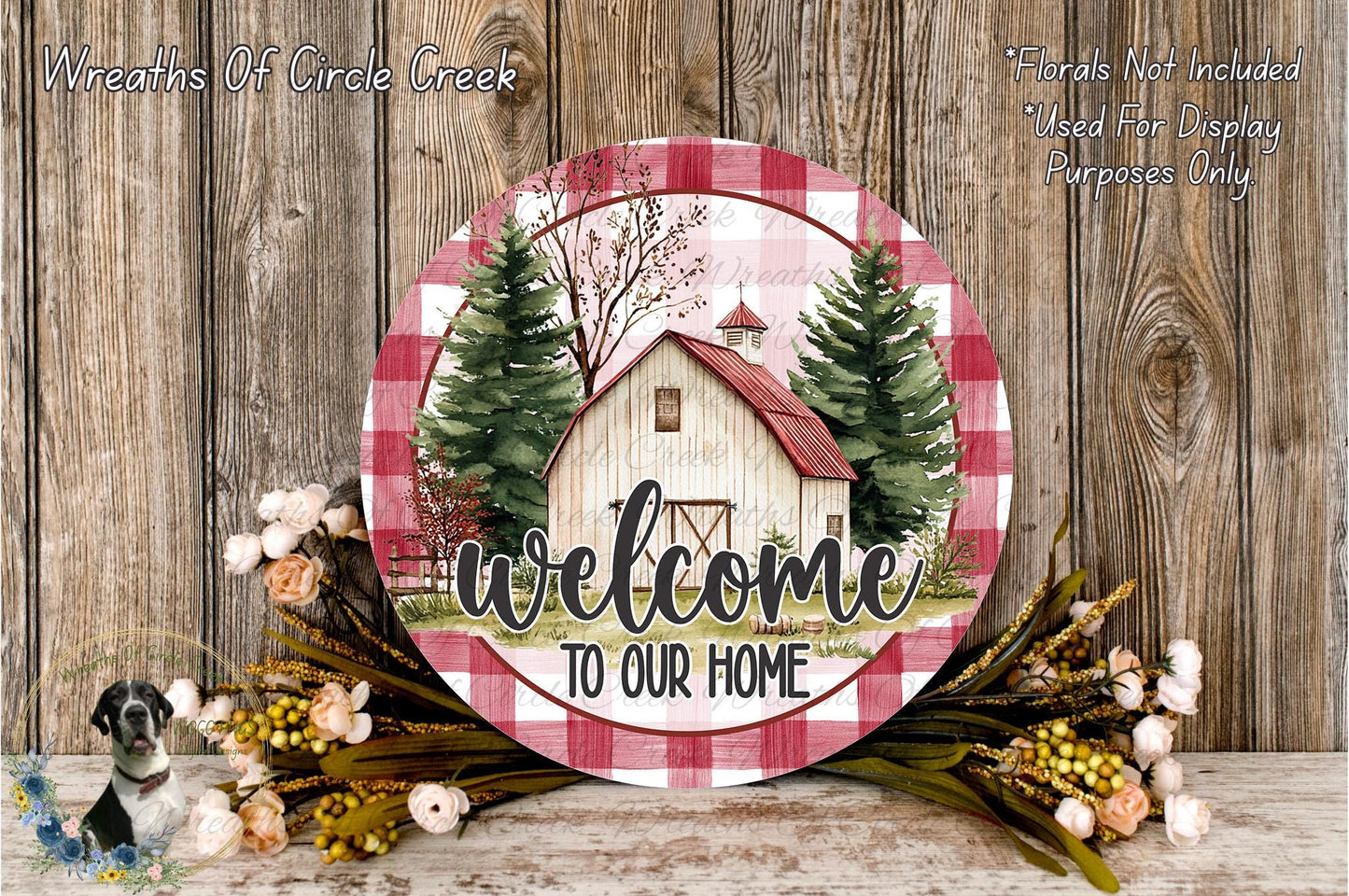 a round wooden sign with a barn and trees, surrounded by flowers and greenery, with the text "Welcome to Our Home" displayed on it.