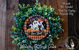 a Halloween-themed wreath made of green foliage and pumpkins, with a ghost and a cat depicted on it. The wreath is displayed on a wooden surface, and there is a text overlay that reads "Wreath Not Included * Used For Display Purposes Only" and "Wreaths of Circle Creek".