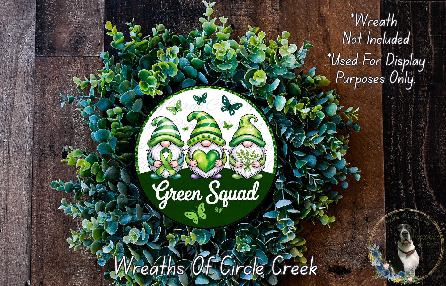 a green wreath with a picture of a frog on it