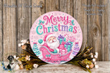 A festive Christmas wreath with a Santa Claus illustration, surrounded by flowers and placed on a wooden surface.