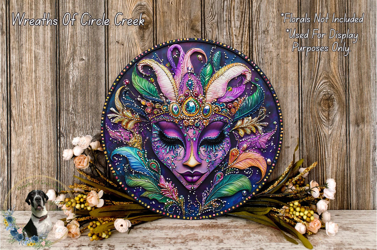 a decorative round plaque with a colorful, intricate face design, surrounded by a variety of flowers and foliage.