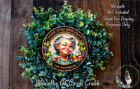 a wreath with a picture of a woman holding a glass of beer