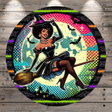 A woman dressed as a witch, wearing a black dress and a purple hat, is depicted flying on a broomstick against a colorful, starry background with bats and a full moon.