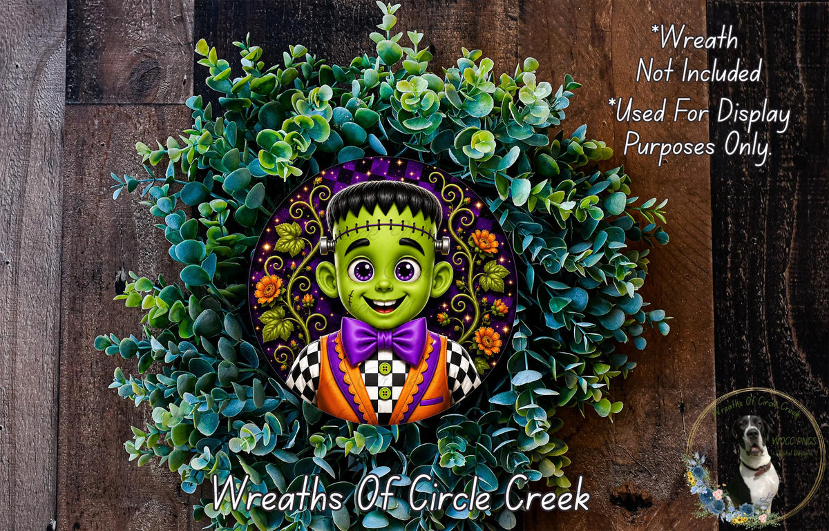 A wreath featuring a cartoonish green monster with a purple bow tie, surrounded by a lush green plant.