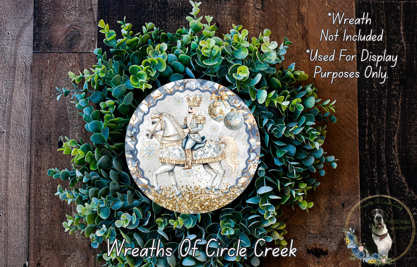 a wreath with a decorative plate containing a knight on horseback, surrounded by a lush green plant arrangement.