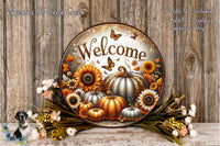 a decorative welcome sign with a rustic wooden background, surrounded by autumn-themed elements such as pumpkins, sunflowers, and flowers.