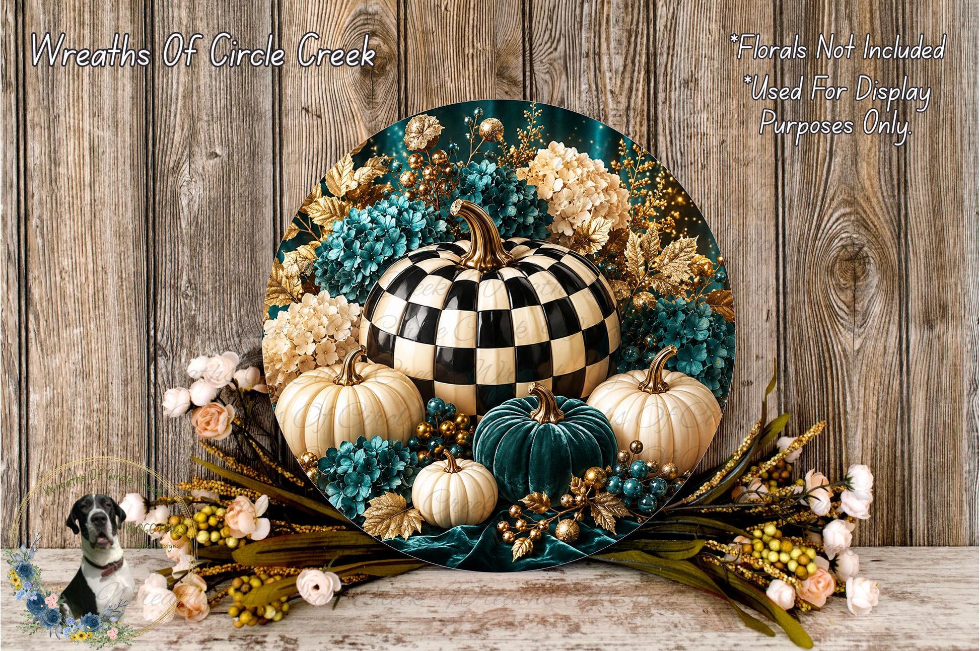 A decorative wreath made of various materials, including a large black and white checkerboard pumpkin, white pumpkins, blue and green flowers, and other fall-themed elements, displayed on a wooden surface.