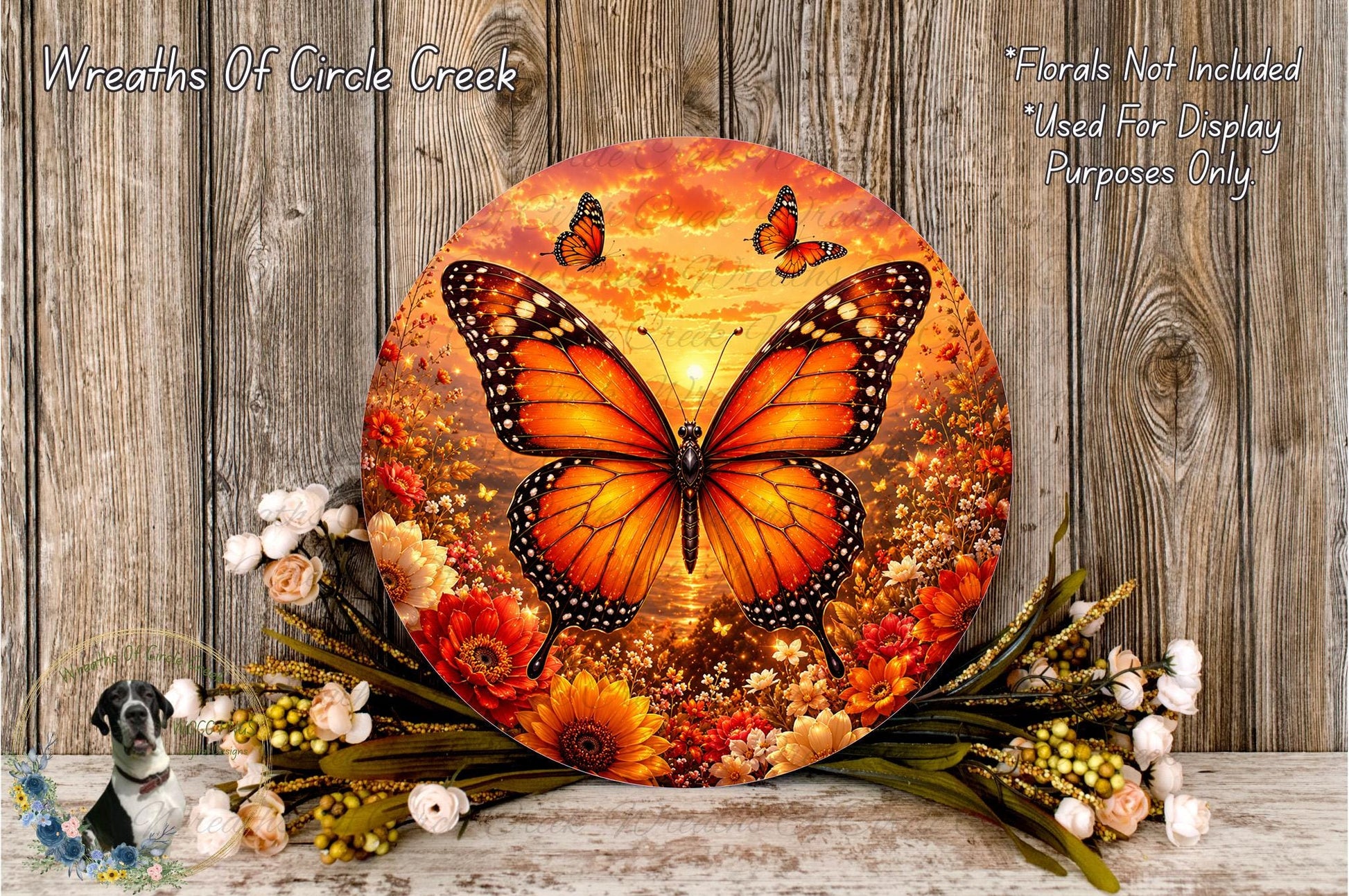 a large circular wreath with a vibrant butterfly design, surrounded by a variety of colorful flowers and foliage.