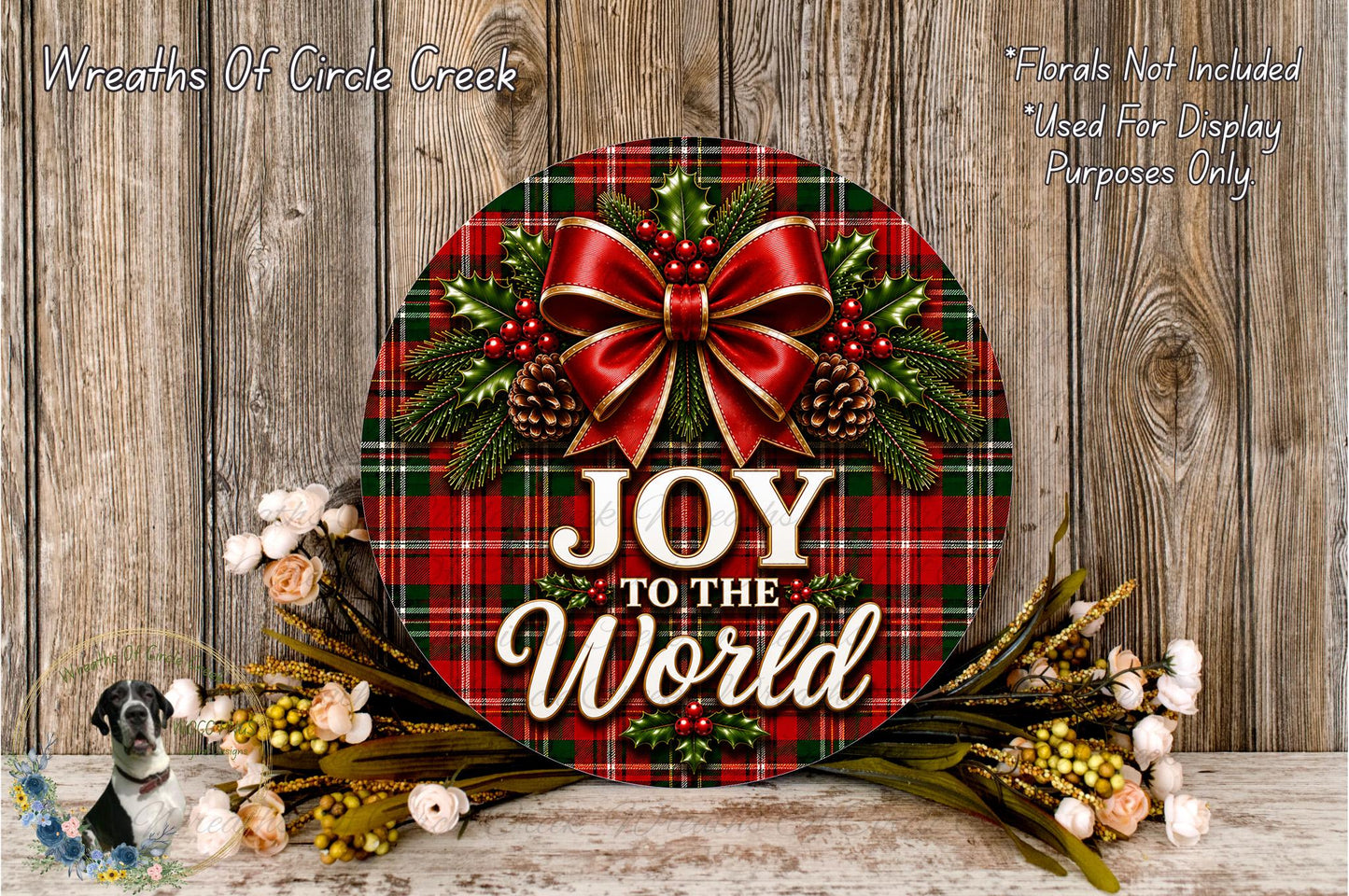 A festive wreath with a red bow and the text "Joy to the World" displayed on it, surrounded by various holiday decorations such as pine cones, flowers, and greenery.