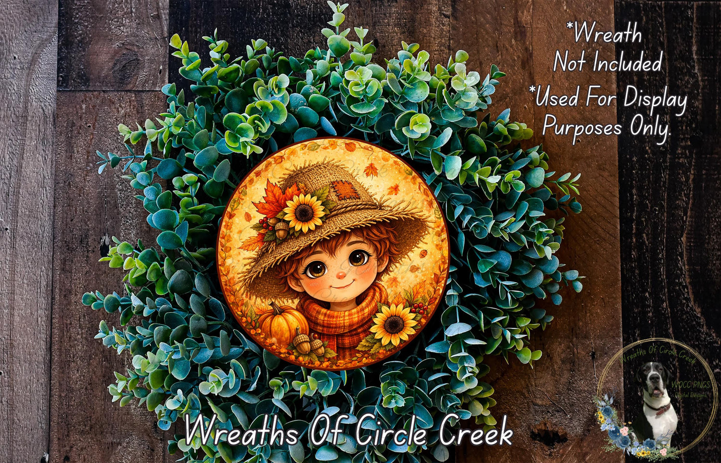 A wreath made of green leaves and flowers, with a circular frame featuring a smiling child wearing a straw hat and holding a pumpkin.