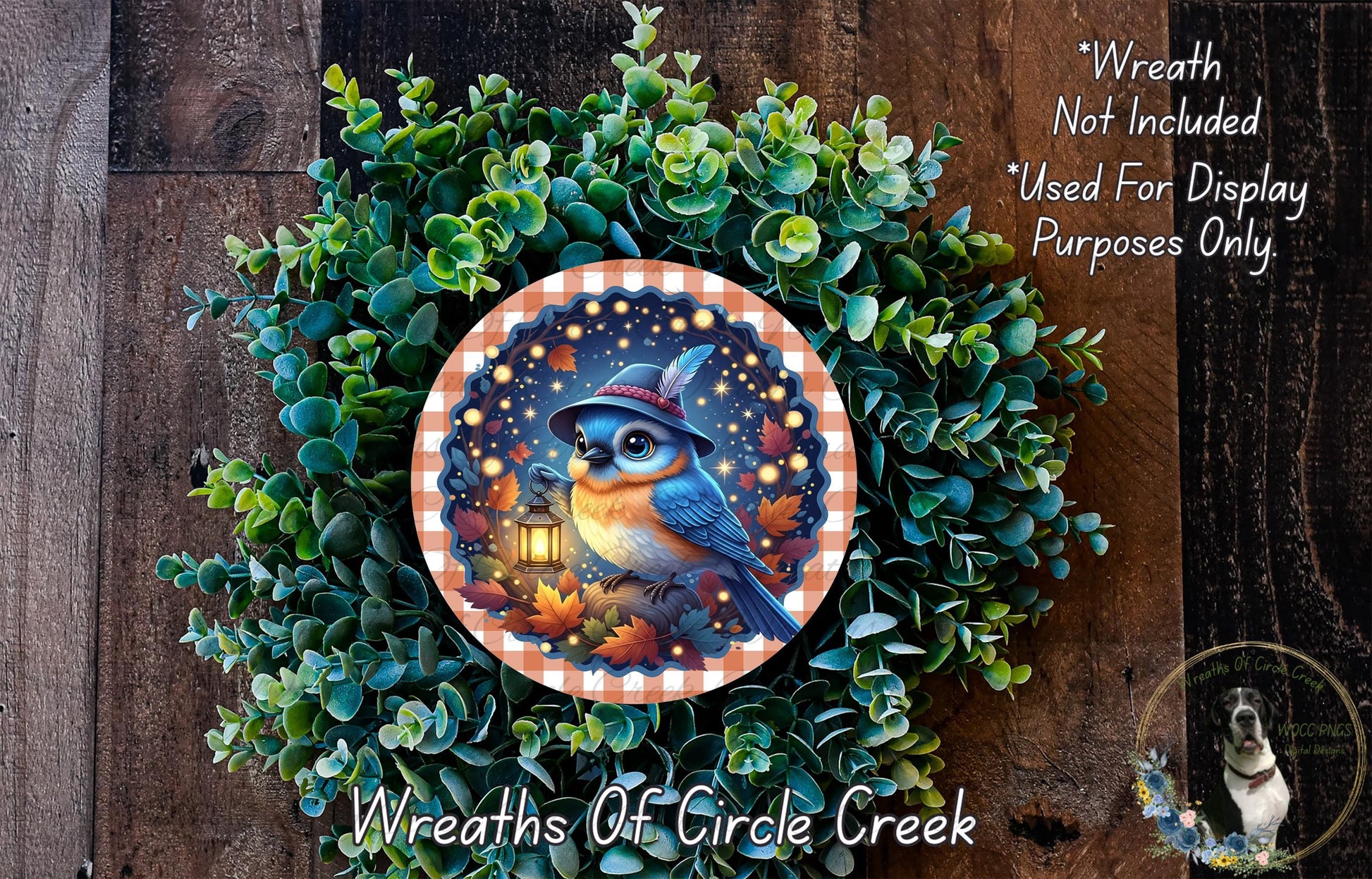 A wreath made of green leaves and a blue bird with a lantern, set against a dark wooden background.