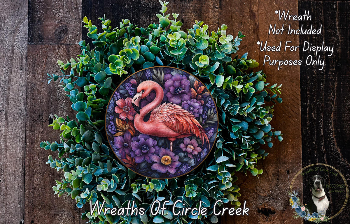 a wreath with a pink flamingo painted on it