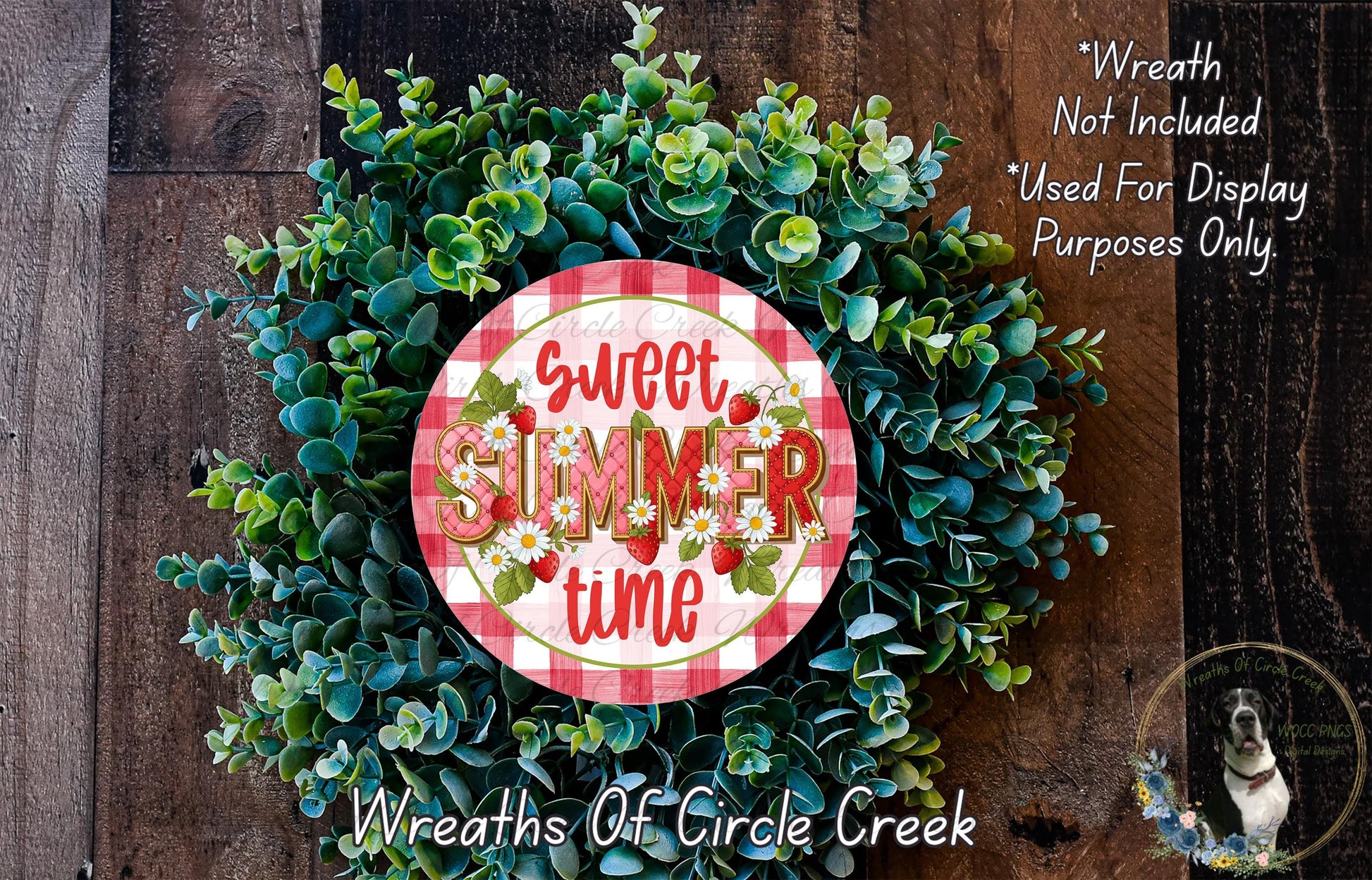 a wreath made of green leaves and flowers, with a red and white sign that says "Sweet Summer time" in the center.