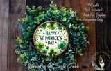 A wreath made of green leaves and shamrocks, with a circular sign that reads &quot;Happy St. Patrick&#39;s Day&quot; in the center.