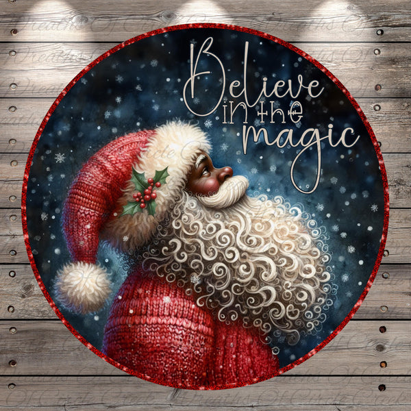 Santa Claus with a red hat and beard, surrounded by snowflakes and the text "Believe in the magic"