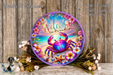 a colorful, circular wreath with a crab and tropical flowers, placed on a wooden surface.