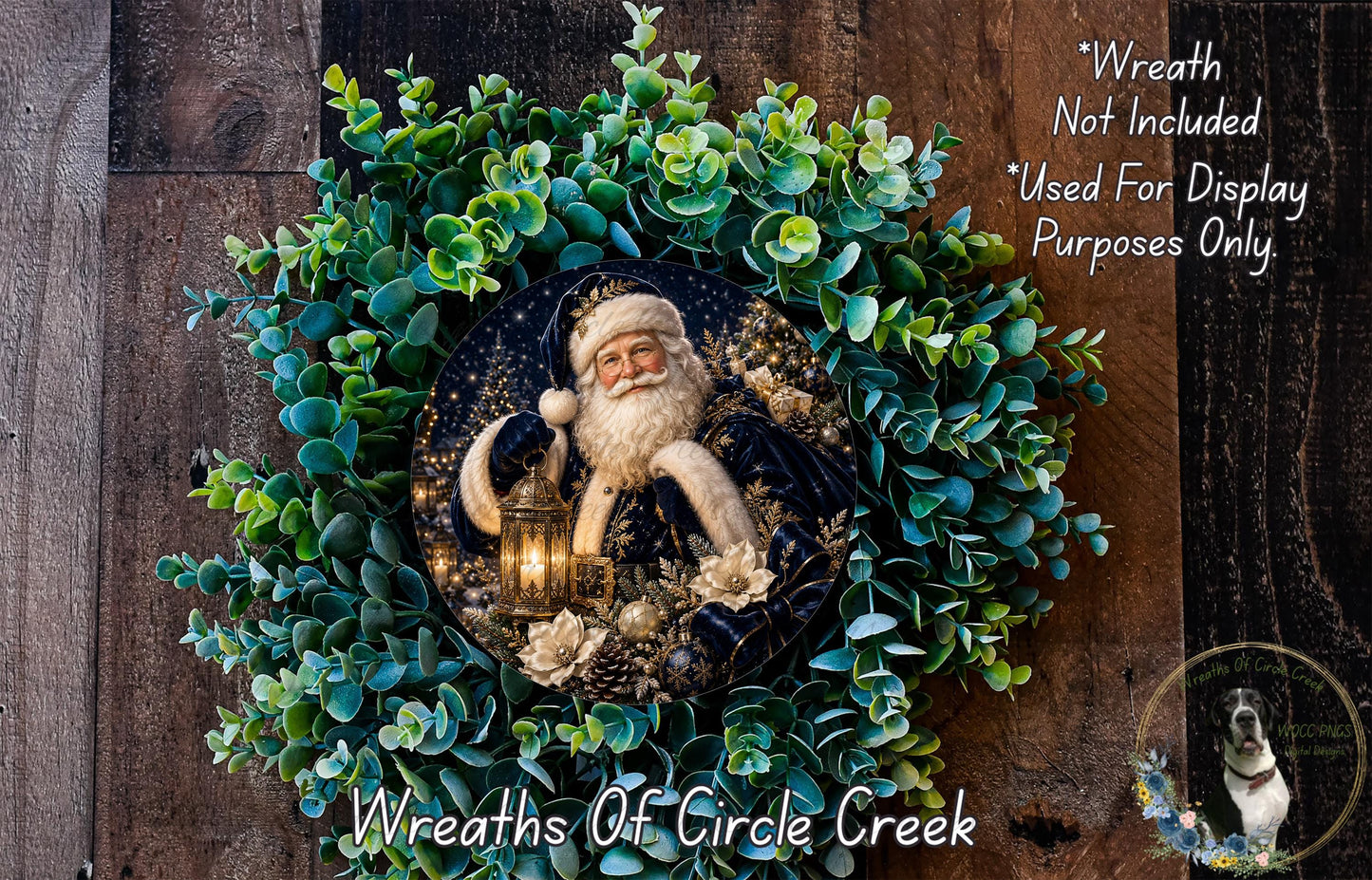 A wreath featuring a Santa Claus figure surrounded by greenery, with a lantern in his hand. The wreath is displayed on a wooden surface, and there is a text overlay that reads "Wreath Not Included * Used For Display Purposes Only".