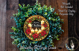 A festive Christmas wreath made of greenery and adorned with lit candles, featuring the text "Merry Christmas" and "Weights of Circle Creek".