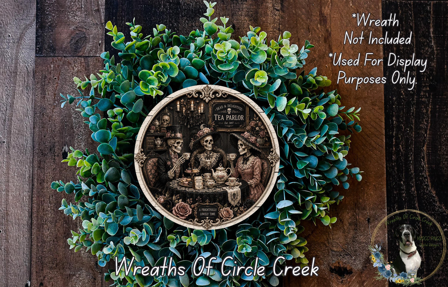 A wreath made of green leaves and a circular metal plate featuring a skeleton and a teapot, with the text "Wreath Not Included * Used For Display Purposes Only" and "Wreaths of Circle Creek" below.