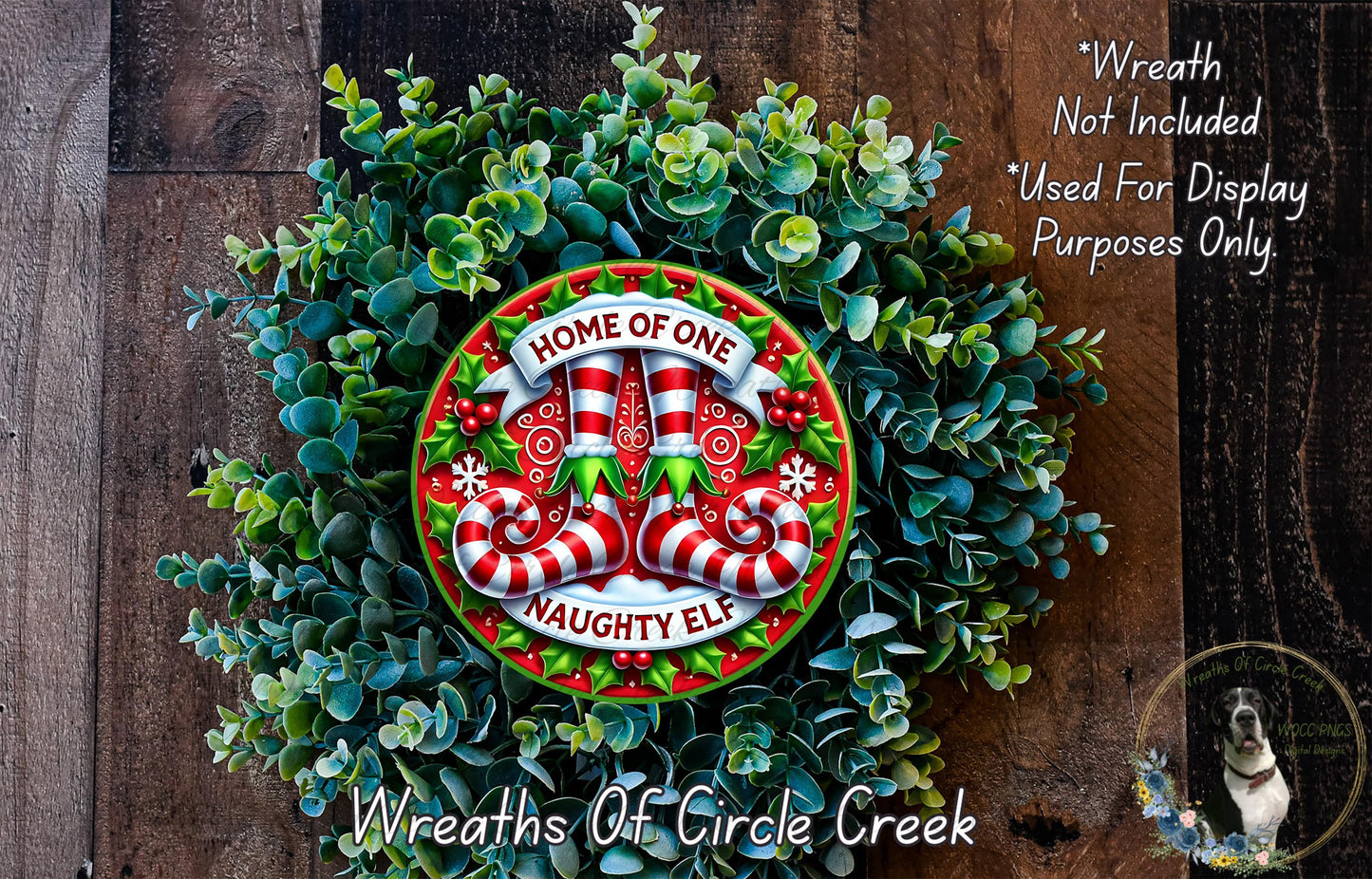 a festive wreath made of green leaves and red and white striped ornaments, with a central circular ornament that says "HOME OF ONE Naughty Elf".