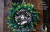 A wreath featuring a woman with a black cat, surrounded by green foliage. The wreath is described as a "Wreath of Circle Creek" and is not included in a display.