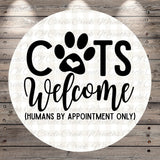 a circular sign with the text "CATS Welcome (HUMANS BY APPOINTMENT ONLY)" written on it.