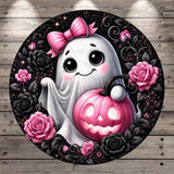 A whimsical Halloween-themed illustration featuring a ghost with a bow, holding a carved pumpkin, surrounded by pink roses and black roses against a dark background.
