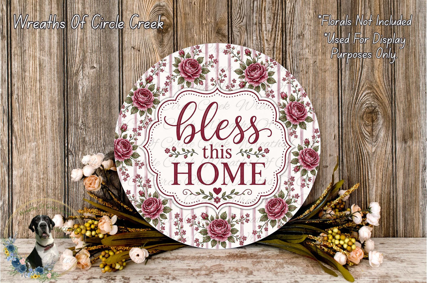 a decorative sign with the text "bless this home" surrounded by a floral arrangement and a wooden background.