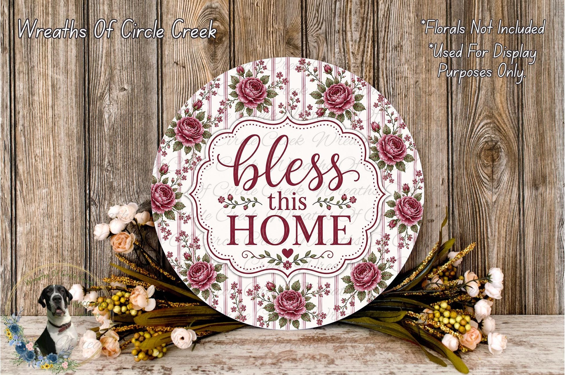 a decorative sign with the text "bless this home" surrounded by a floral arrangement and a wooden background.