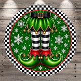 A festive Christmas-themed image featuring a pair of green elf boots with black and white striped legs, red tassels, and gold bells, surrounded by snowflakes and a black and white checkered border.