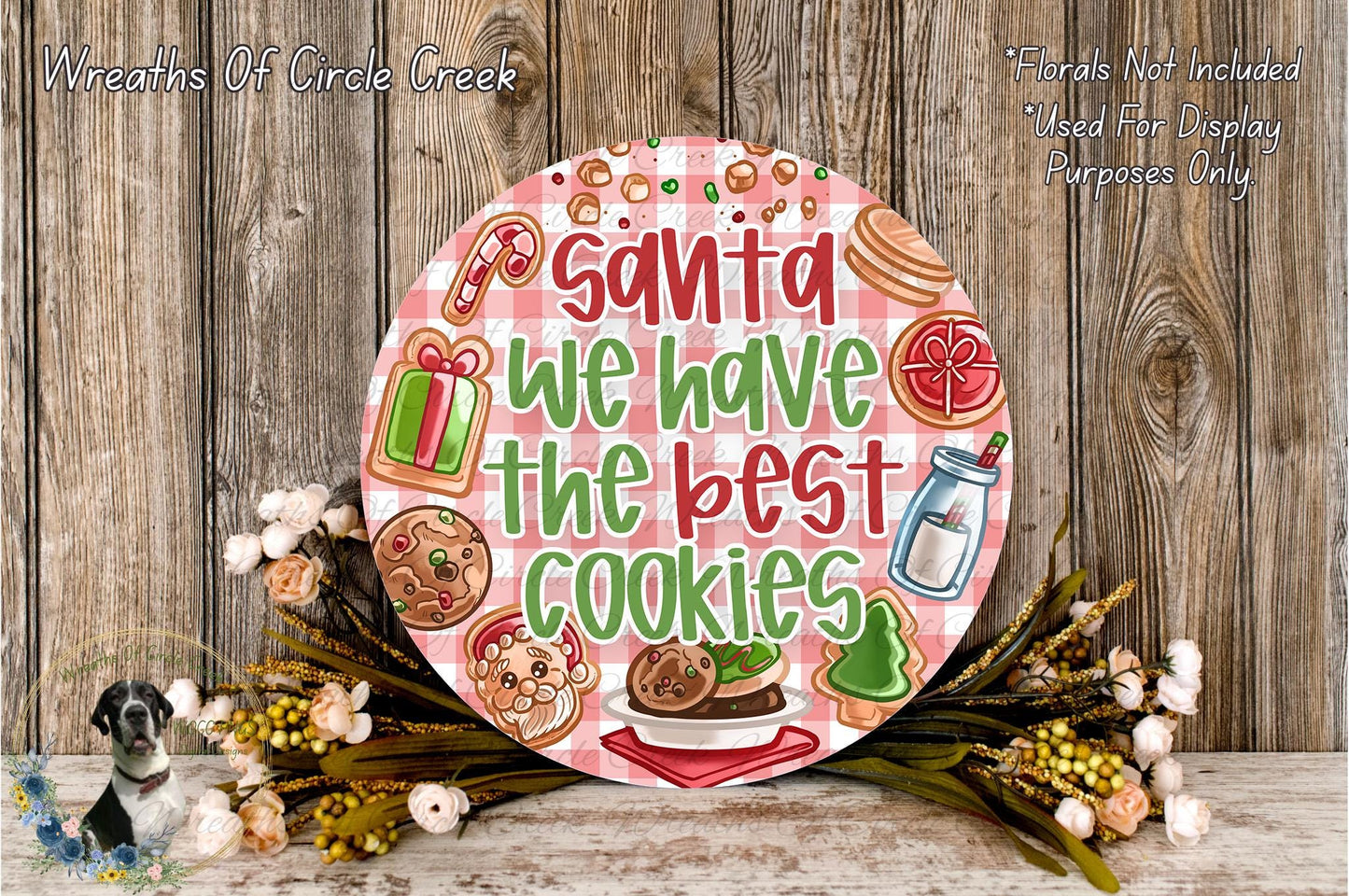 Santa Claus sign with the text "Santa we have the best cookies" surrounded by various holiday-themed items such as cookies, a gift box, and a bottle of milk.