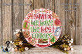 Santa Claus sign with the text "Santa we have the best cookies" surrounded by various holiday-themed items such as cookies, a gift box, and a bottle of milk.