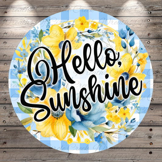 A circular design with a blue and white checkered pattern, surrounded by yellow flowers and green leaves. The text "Hello, Sunshine" is written in a cursive font.