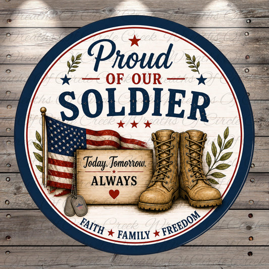 The image is a patriotic design featuring a circular border with a blue border and a white background. The design includes an American flag, a pair of boots, and a sign that reads "Today. Tomorrow. Always." The design also includes the text "Proud of our SOLDIER" and "Faith, Family, Freedom" around the edges.